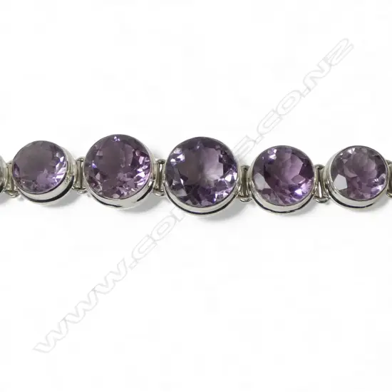 SILVER & AMETHYST BRACELET; STONES ARE GRADUATED