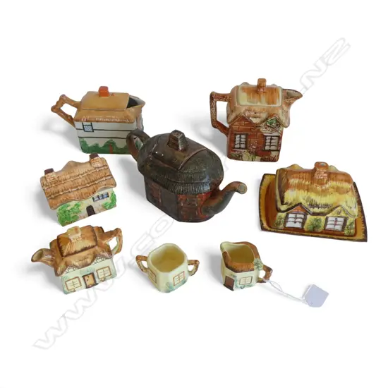 8 PCES COTTAGE WARE; 4 TEAPOTS, 2 LIDDED CONTAINERS, MILK JUG & SUGAR BOWL