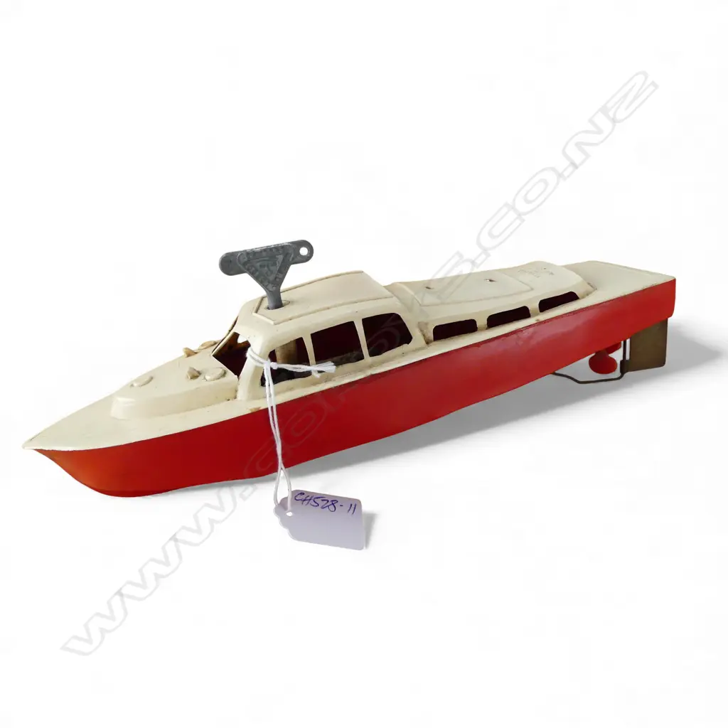 VINTAGE 'PENGUIN' made in NZ PLASTIC TOY SPEED BOAT L.290mm  key wind working with key. Something missing from top? Image 1++