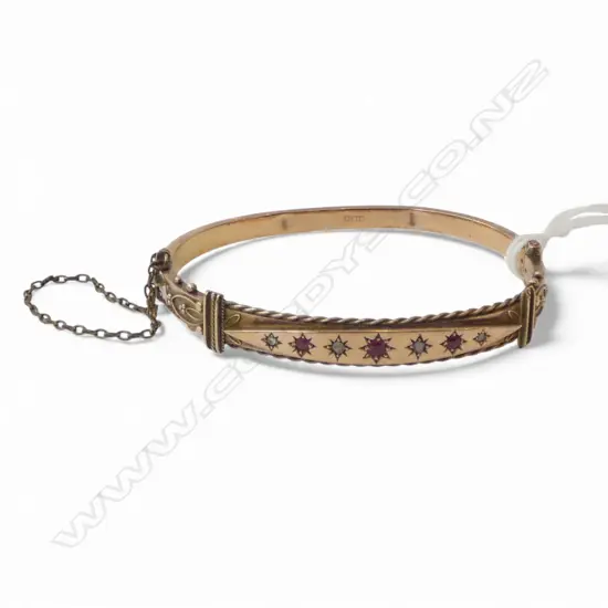 LATE VICTORIAN 9CT ROSE GOLD RUBY AND DIAMOND BANGLE CHESTER 1881 9.90gms (dented)