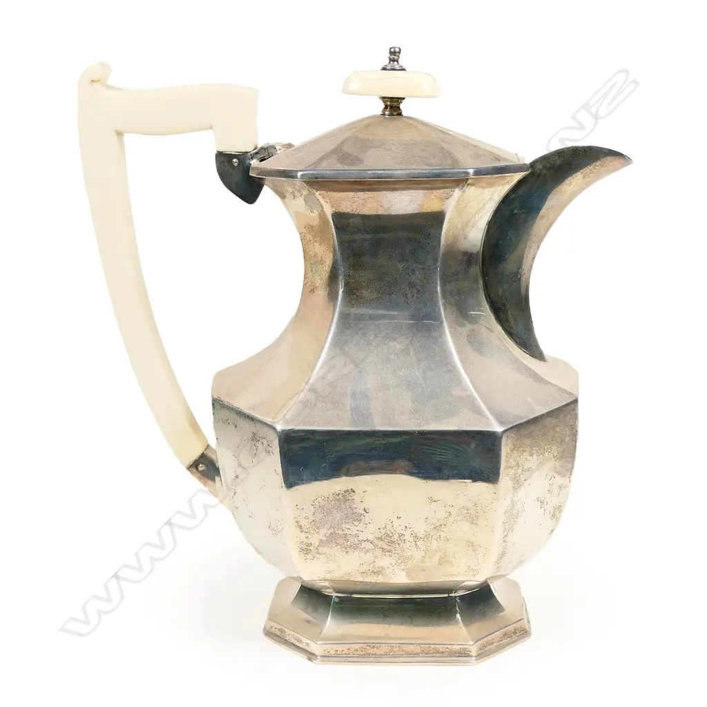 An Art Deco silver hot water pot with ivory handle and finial. Sheffield 1935 by Viners Ltd. 665gm Image 1++