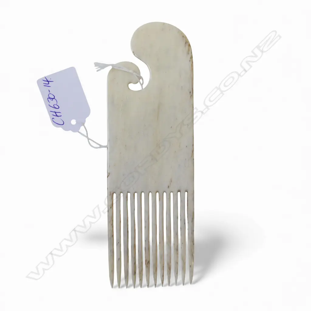 David Tuart carved whalebone heru comb with scrolling top and 12 tines. In good polish. L.155mm Image 1++