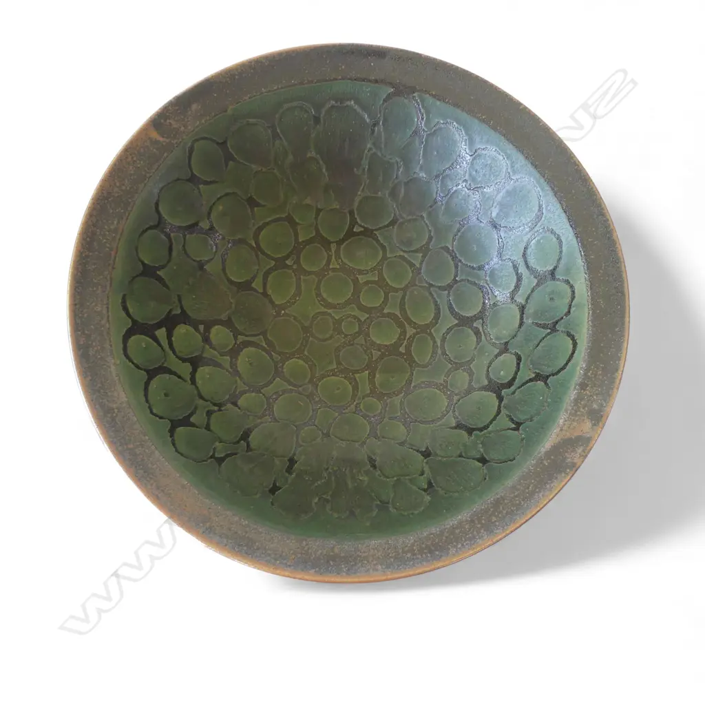 Graeme Storm large bowl - wax resist green glaze patterned decoration on iron glaze ground. Impressed potter's mark. Dia.375mm. Image 1++