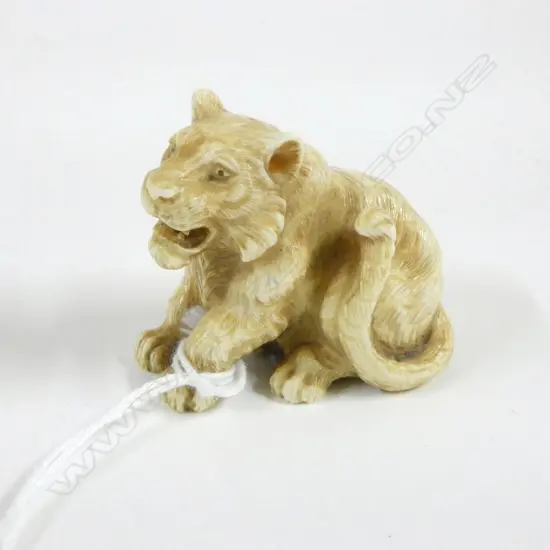 IVORY NETSUKE LION, SIGNED