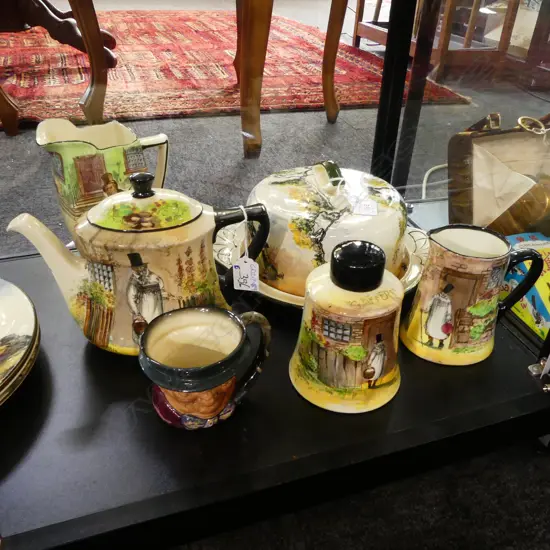 6 PCES ROYAL DOULTON; CHEESE DISH, 'GAFFERS' MILK JUG & TEAPOT & TEA CADDY, 'BARKIS' JUG & CHARACTER JUG H.170mm