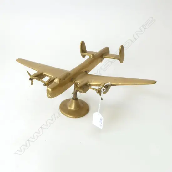 HEAVY SOLID BRASS WWII AEROPLANE ON STAND; R.A.F. TO BASE. H.140 W.345mm 