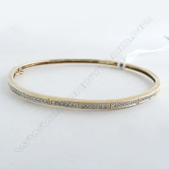 9ct DIAMOND SET BANGLE, Dia. 0.35ct, 7.9gm