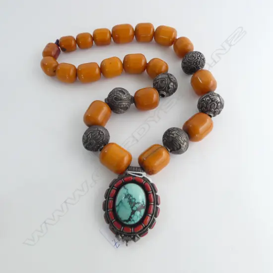 CHUNKY TRIBAL NECKLACE with faux amber beads + decorative silver beads. Silver locket w coral & turquoise jewels