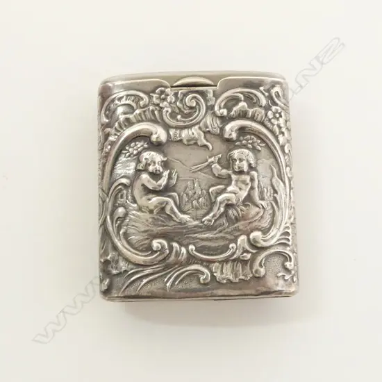 Continental silver embossed VESTA. cherub scene. 'Alpaca' sliding section. striker to end L.50mm