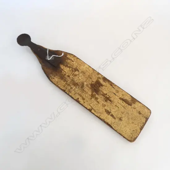 Old Pacific Island Coconut husker. Serrated metal disc end. The board with remains of old paint. L.475mm