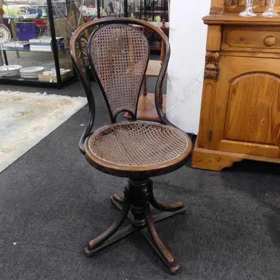 ANTIQUE BENTWOOD SWIVEL CHAIR, CANE AF