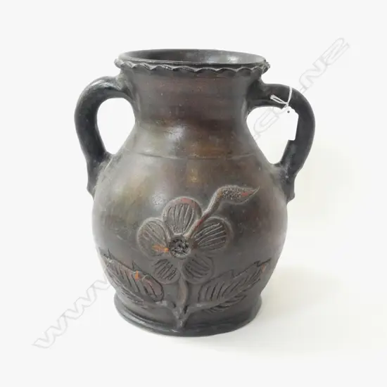 LARGE TERRACOTTA WHO HANDLED ISIS JUG WITH SERPENTINE OPENING & FLORAL APPLED DETAIL, H. 