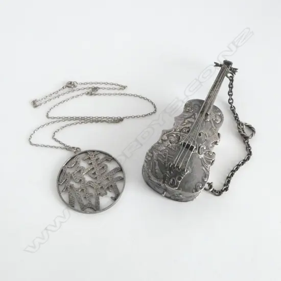 IMPORT 930. SILVER CELLO 46.14gms w. CHINESE PENDENT