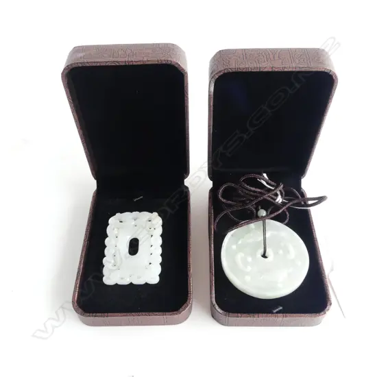 2 ORIENTAL JADE PENDANTS, each cased 55mm dia