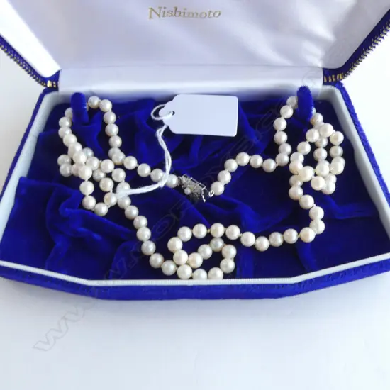 STRAND UNIFORM HIGH LUSTRE CULTURED NISHIMOTO PEARLS individually knotted w silver clasp. L.660mm.