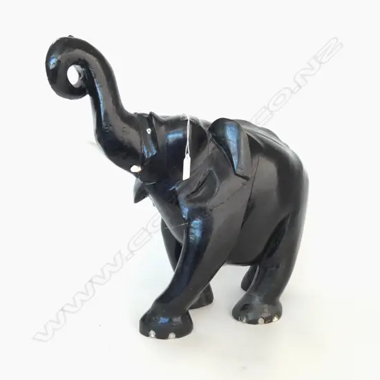 LGE CARVED EBONY ELEPHANT. Trunk raised repaired 1 tusk absent. H.460mm