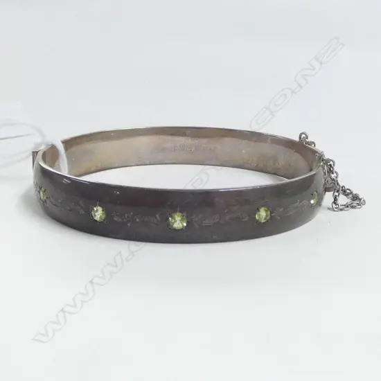 SILVER HINGED BANGLE scroll engraved & set w 5 green stones (peridots?) 39gms