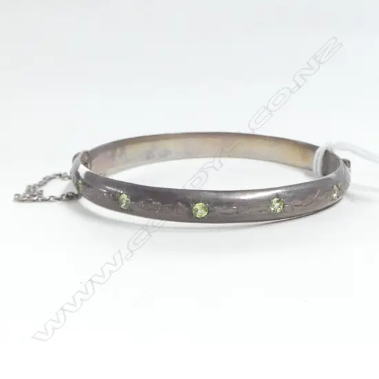 SILVER HINGED BANGLE scroll engraved & set w 5 green stones (peridots?) 27gms