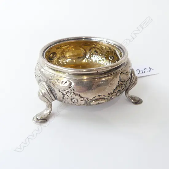 An early Victorian silver salt compressed circular form with embossed floral decoration 107gms