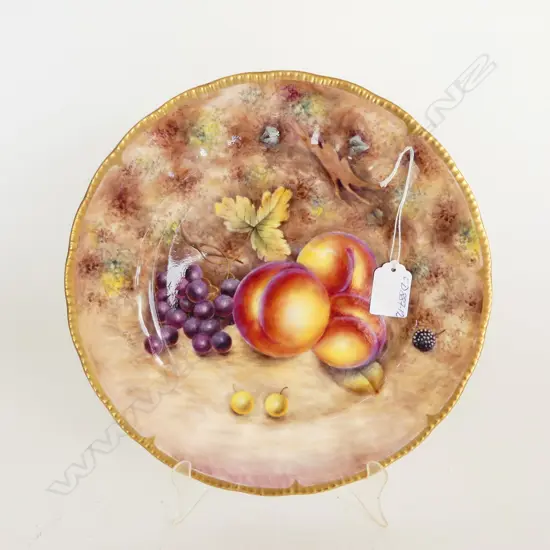 A fruit painted plate by Gerald Delaney