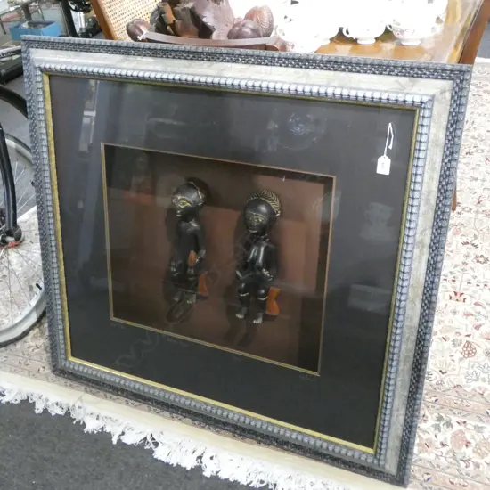 TWO AFRICAN CARVED & DARK PIGMENT FINISHED FIGURES in lge frame UV glass. 'Fanti Couple Ashanti Region... 950 x 1040mm