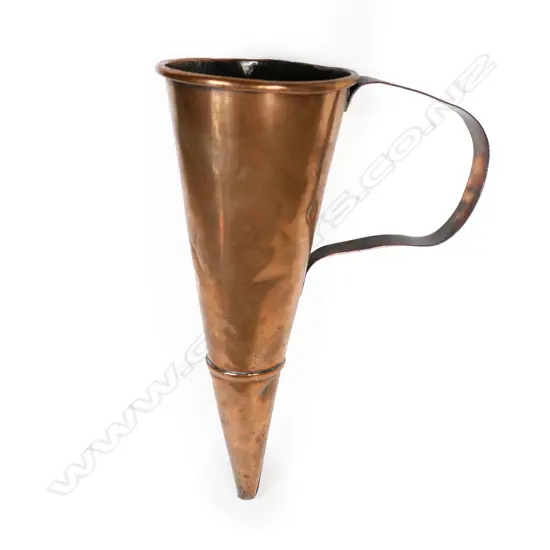 An antique copper muller,