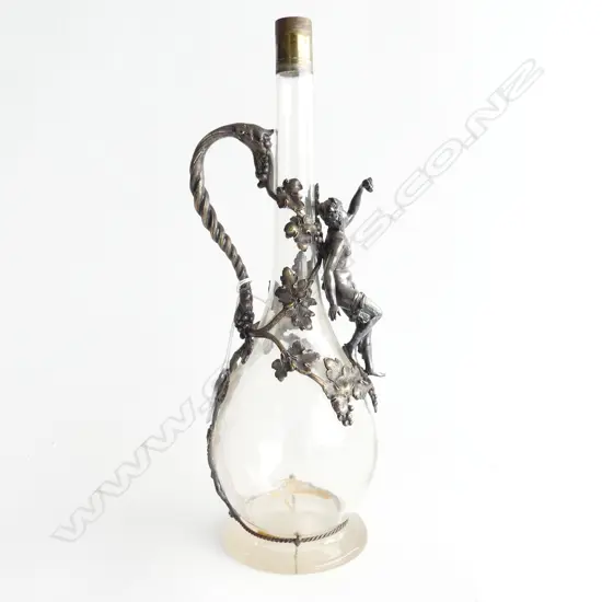 A decanter with relief of baccus, grape leaves,