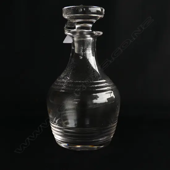 A decanter with flat stopper,