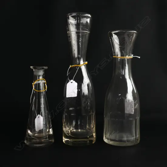 Three small assorted serving flacons,