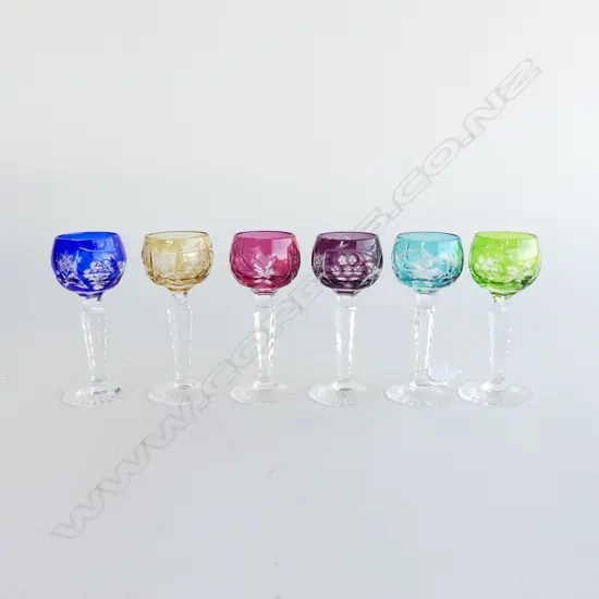 Six multi-coloured liqueur glasses,