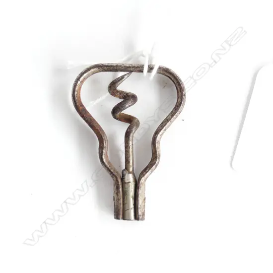 A baby’s bow corkscrew.,