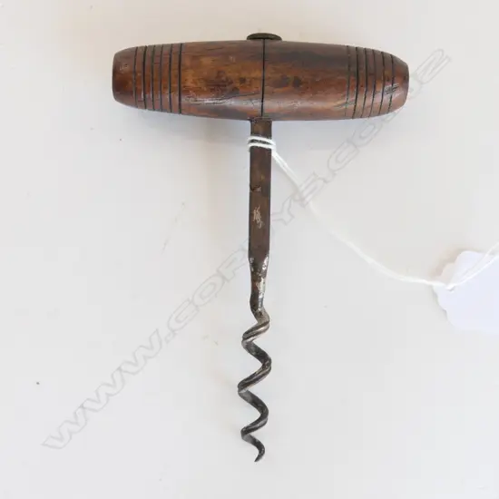A wooden handled early corkscrew