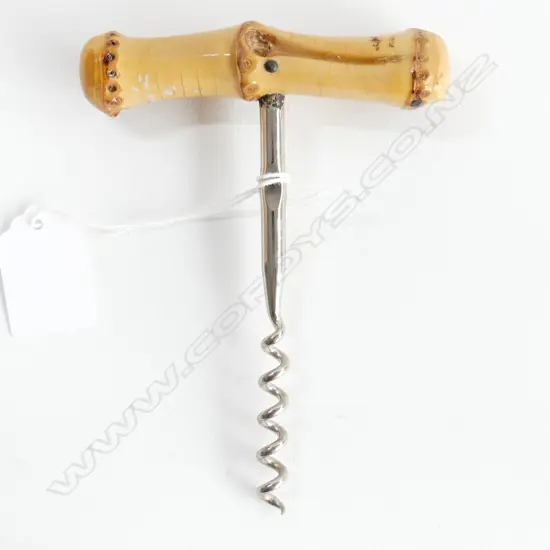 A large stainless corkscrew,