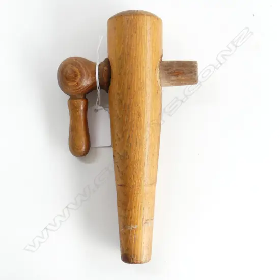 A wooden cask barrel tap,