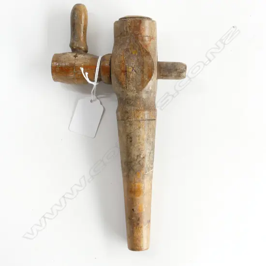 A wooden cask barrel tap,