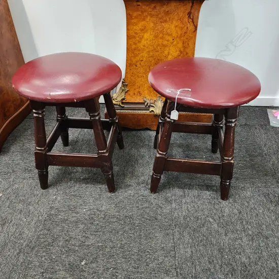 HEAVY PAIR OF VINTAGE WOODEN STOOLS – DARK WOOD WITH RED UPHOLSTERED SEATS 