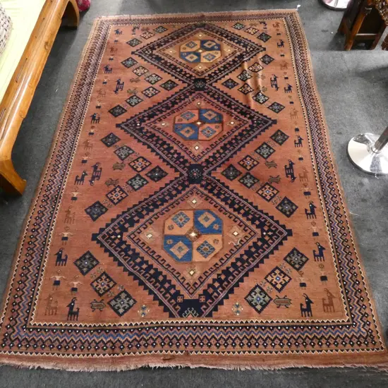 LARGE HAND KNOTTED ALL WOOL RUG three medallion, rosettes, goats & figures to field 3000x2000mm