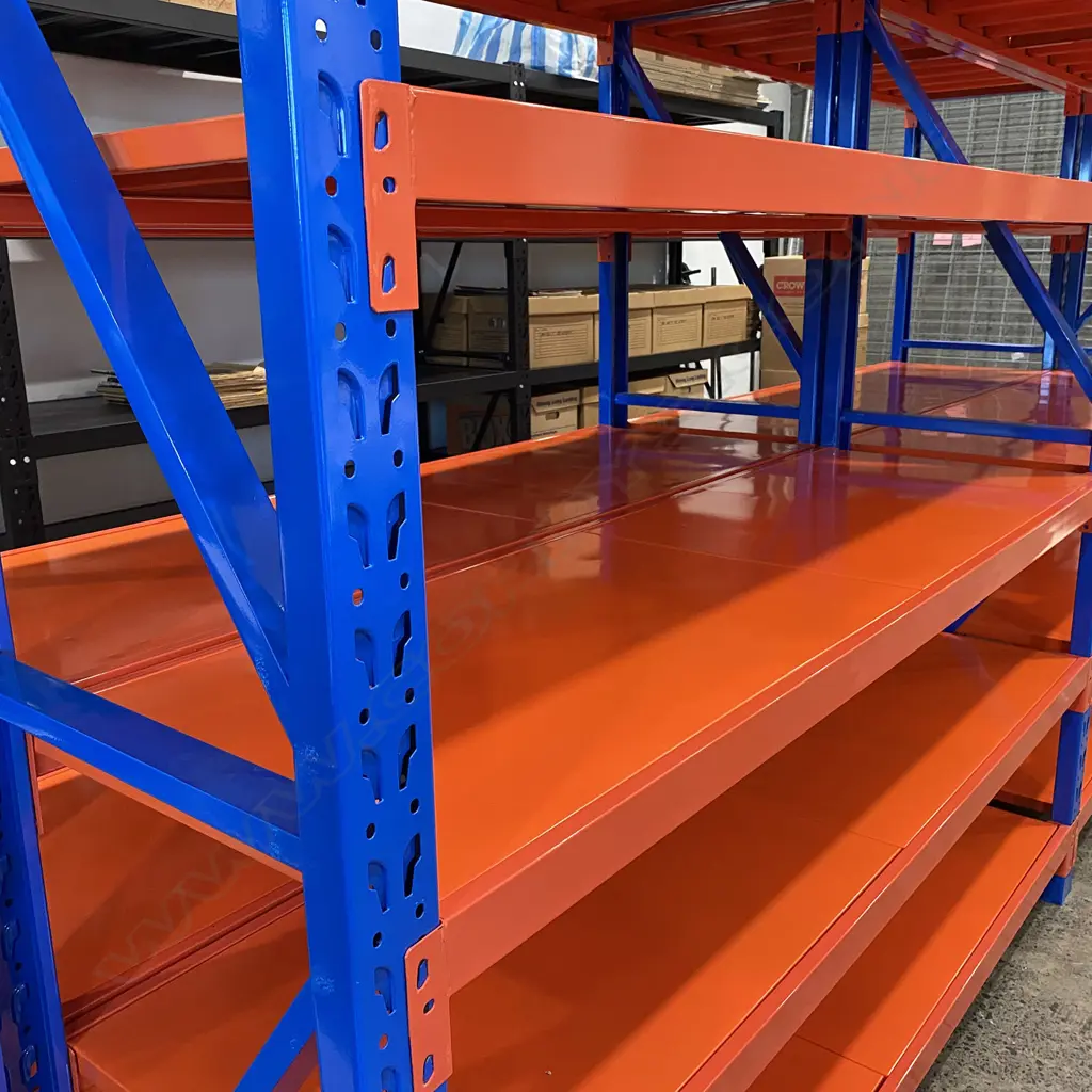 5 CONNECTED BAYS OF ORANGE/BLUE METAL SHELVING: Each bay with 8 shelves (2 part). 8 shelf supports + uprights Image 1++