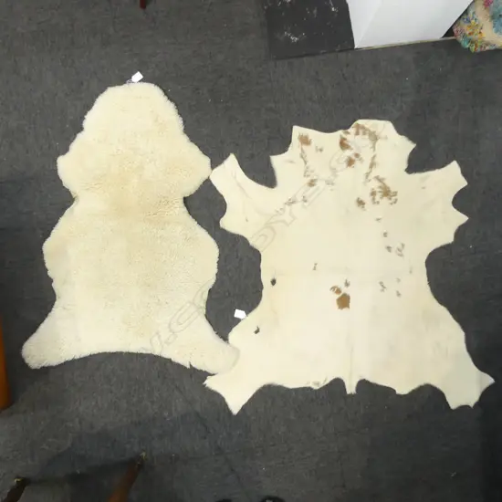TWO SMALL TANNED LEATHER ANIMAL HIDES