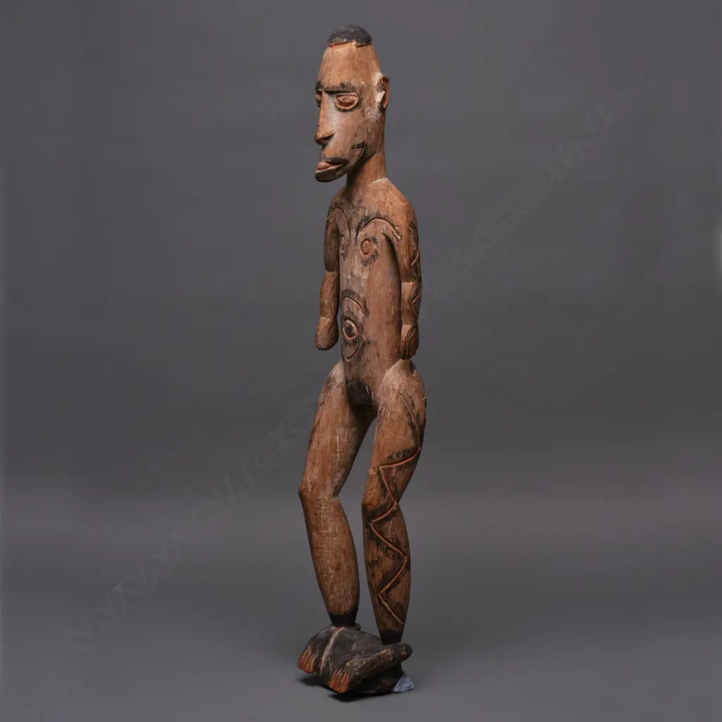PNG carved wooden standing figure, ochre & black stain, H.760mm Image 1++