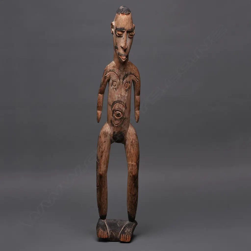 PNG carved wooden standing figure, ochre & black stain, H.760mm Image 1++