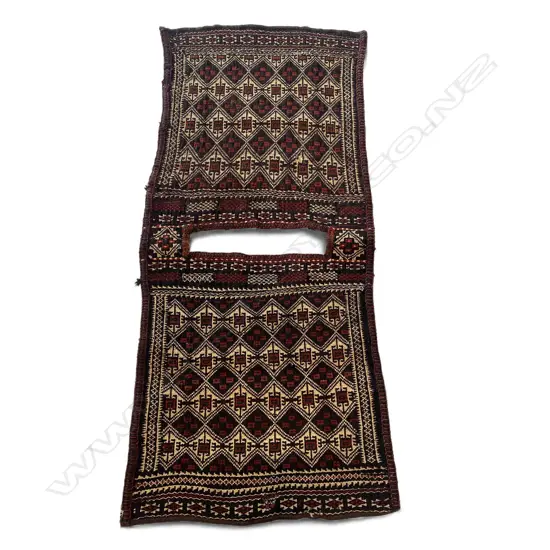 Wool flatweave saddle cloth,  two-part, diamond motif on red, brown, cream ground, 1365 x 655mm