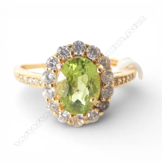 PERIDOT & CZ DRESS RING, GILT FINISH, AIG REPORT, one cz discoloured, adjustable band  size