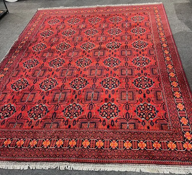 Very large Afghan Baluchi hand knotted carpet w repeating medallion design. Red ground. 3900 x 3000mm threads exposed Image 1++