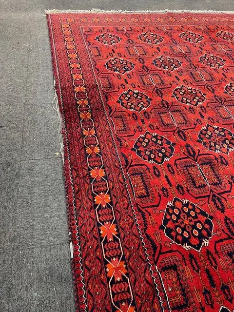 Very large Afghan Baluchi hand knotted carpet w repeating medallion design. Red ground. 3900 x 3000mm threads exposed Image 1++