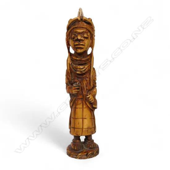 An early 20thC Nigerian carved ivory figure,