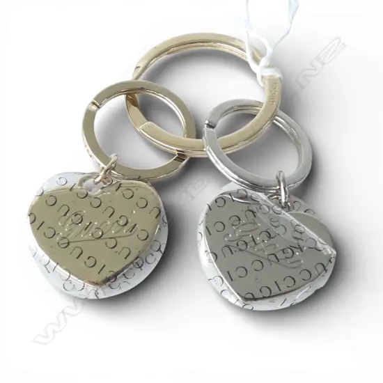 GUCCI GILT METAL KEY CHAIN. Boxed.