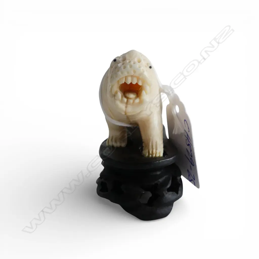 VINTAGE SOLID IVORY CARVED LION SCULPTURE tail end broken. On carved wood base. L.90mm Image 1++