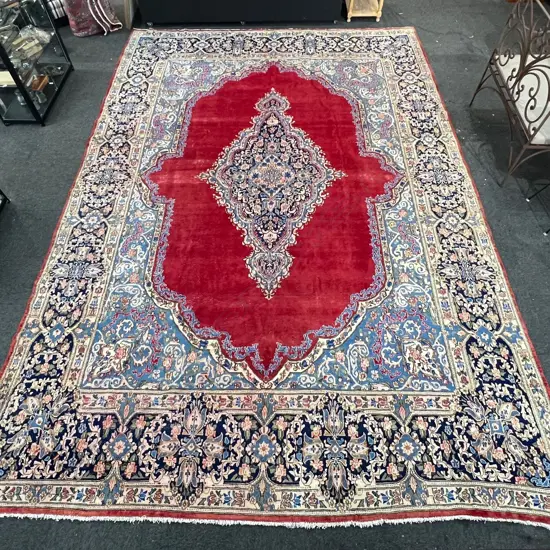 Very large Persian Kerman hand knotted carpet w curvilinear tendril design. Red ground. 5050 x3500mm. Some threads bare