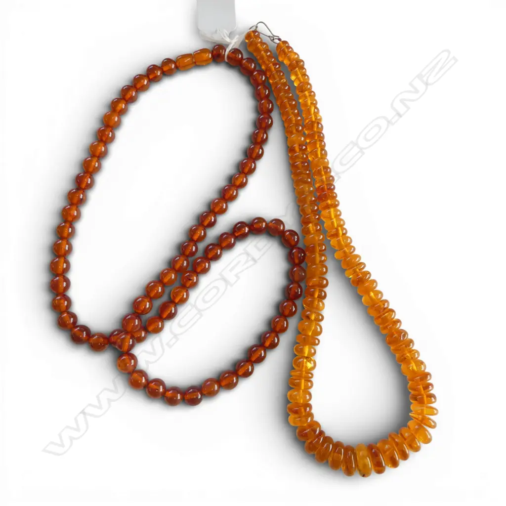 TWO AMBER BEAD NECKLACES From the estate of Simon Misdale Image 1++